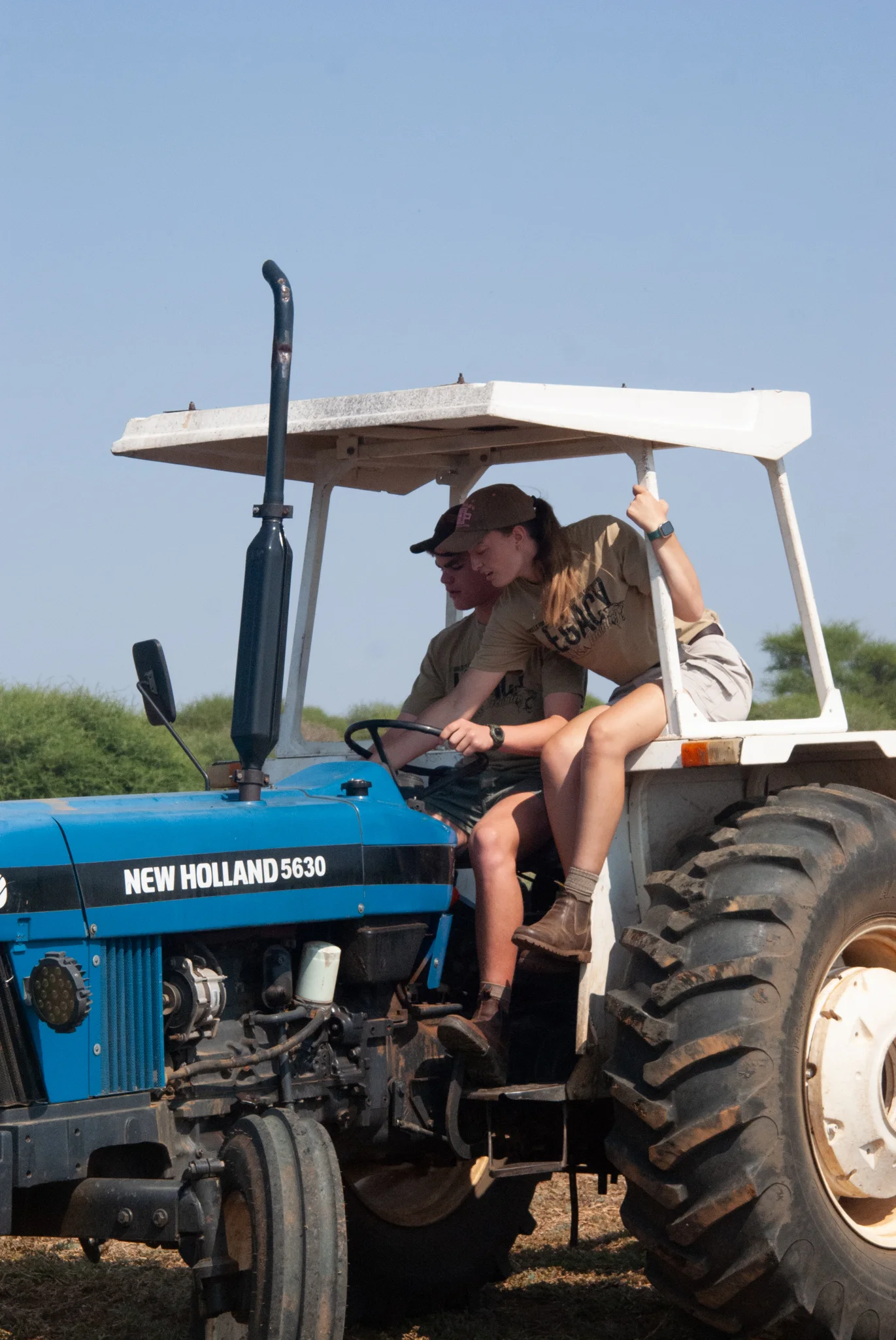 Students learning on a ranch tractor
